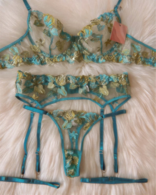 Vintage floral embroidered lingerie set with emerald and gold hues.