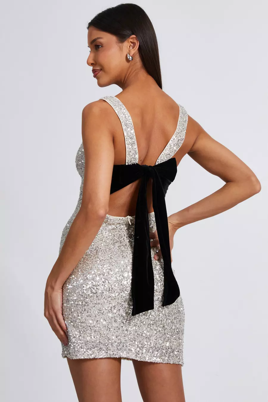 Sophia Holiday Mini Dress with sequins, open-back, velvet bow, festive and elegant design.