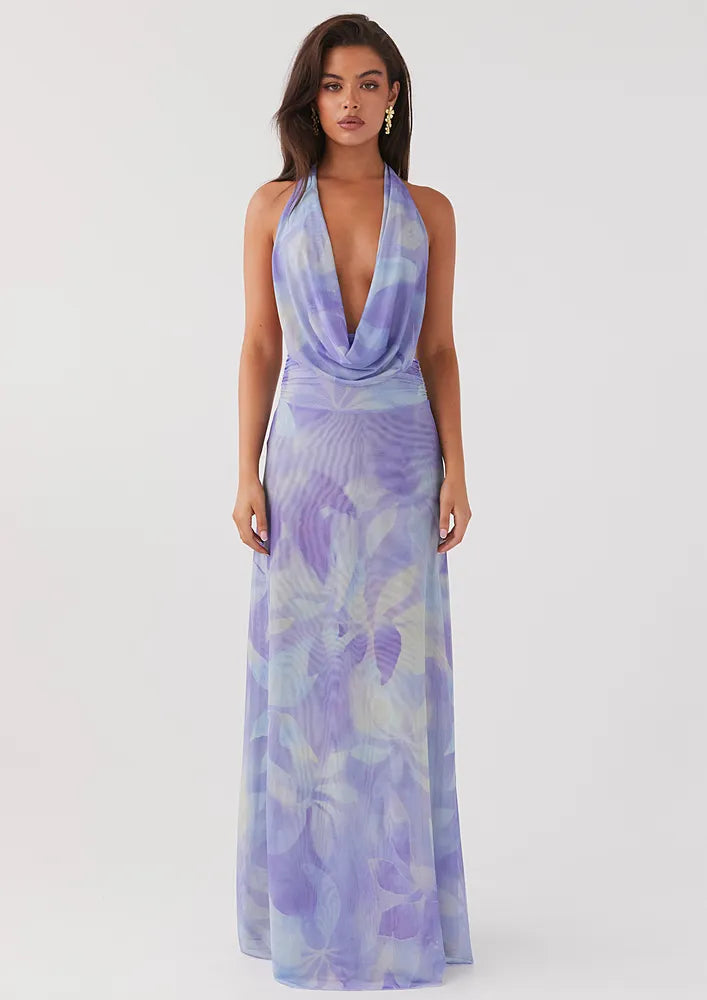 Maeve Backless Formal Dress with lavender print and draped halter neckline.