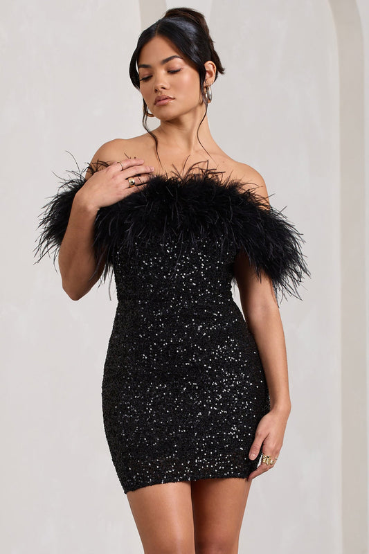 Feather-trimmed black sequin dress with off-the-shoulder design.